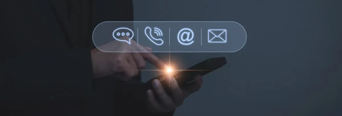Contact information scraping service - hand holding smartphone with holographic communication icons for email and calls