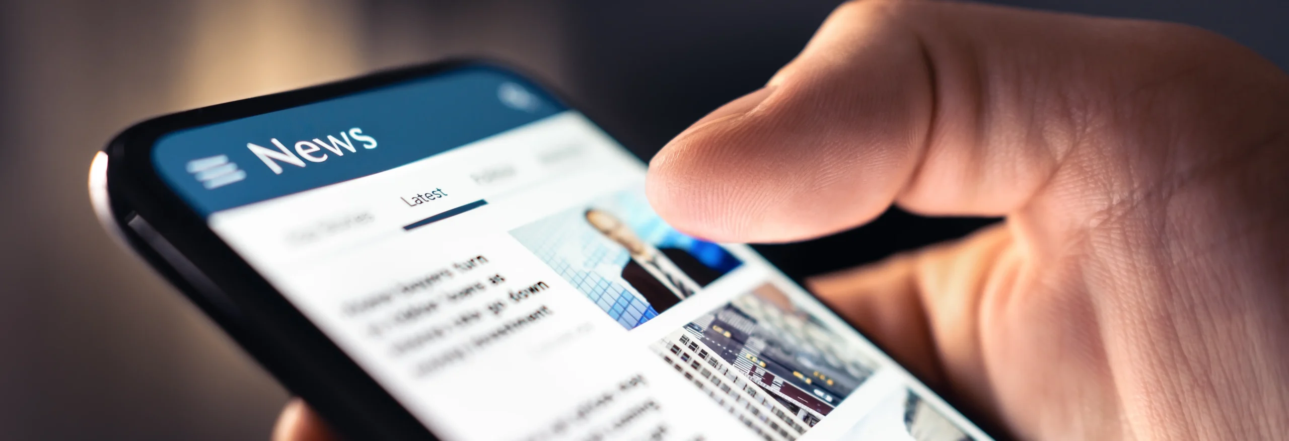 User reading news articles on mobile to convert website to RSS feed for content aggregation