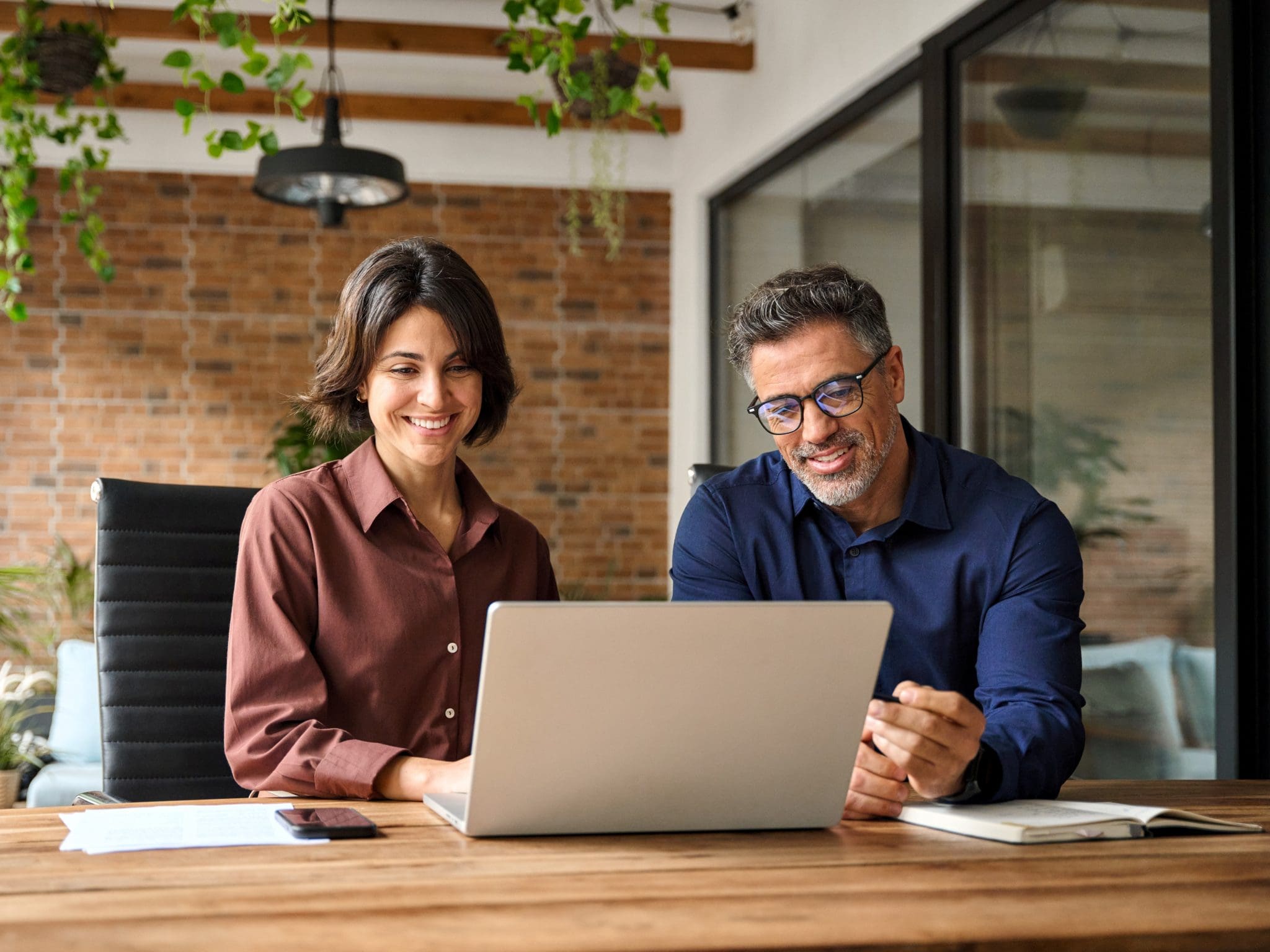 HR professionals collaborating on recruitment strategy using scraping jobs from the internet services