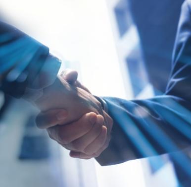 Business handshake with light effects