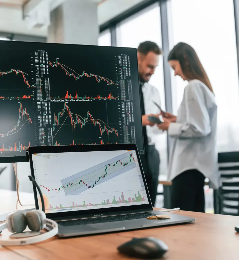 Analyst reviewing printed stock market data report